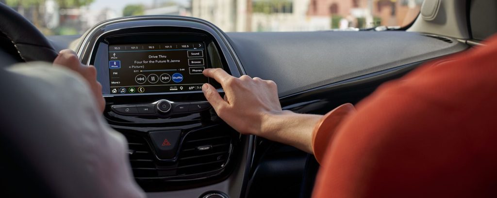Man Using Bluetooth on Touchscreen of Chevrolet Vehicle