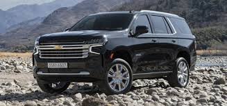 2024 black Chevy Tahoe on a rocky mountain top.